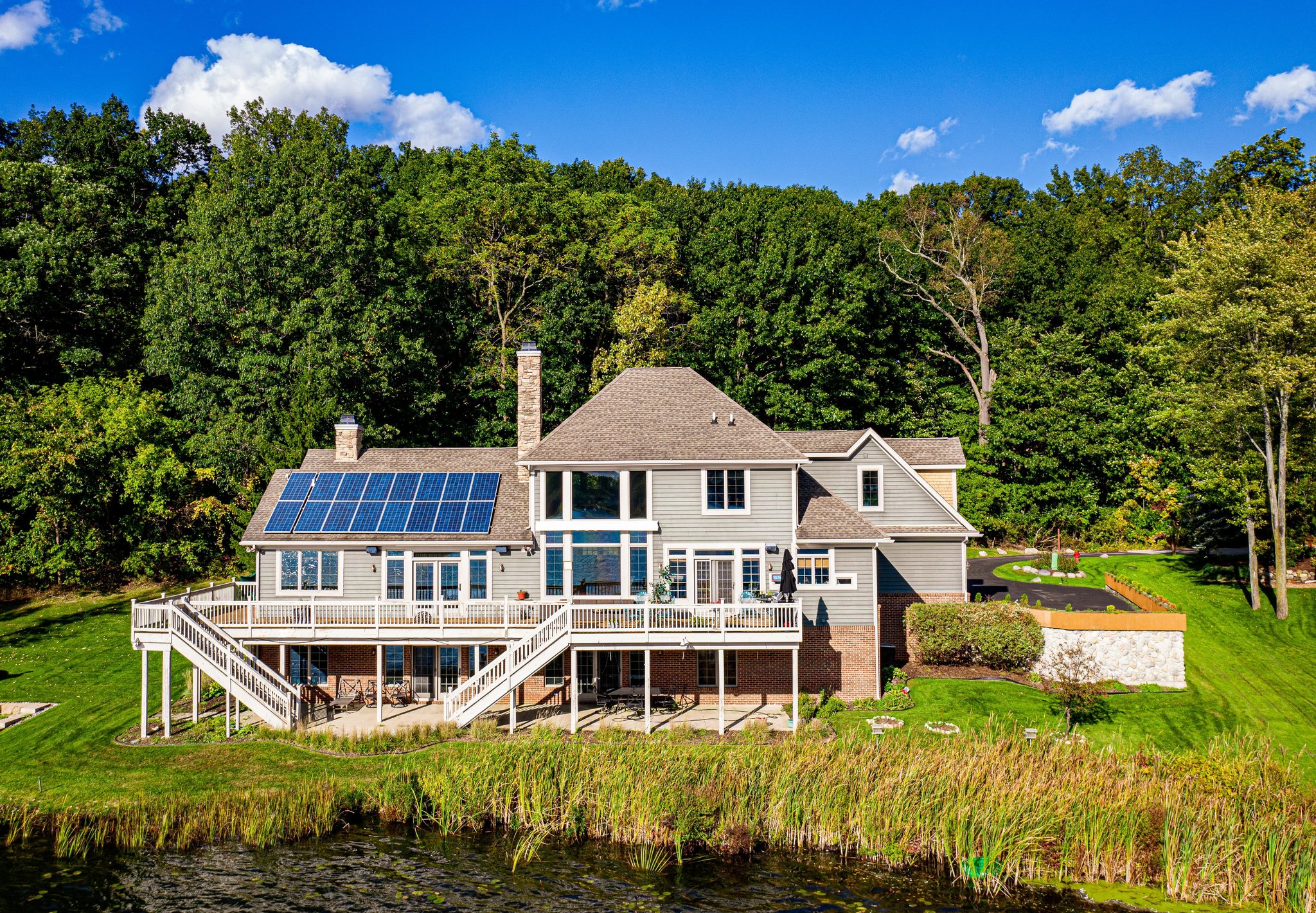 Lake home in Lakeshore Pointe neighborhood in Howell